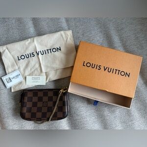 Authentic Louis Vuitton Mini Pouchette in Damier Ebene